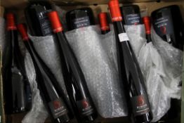 A mixed case of ten bottles of unusual mature red pomegranate wine, produced in Israel.