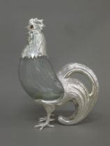 A silver plate mounted cut glass cockerel form claret jug. 33 cm high.