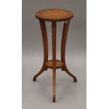 A Victorian satinwood wine table. 26.5 cm diameter.