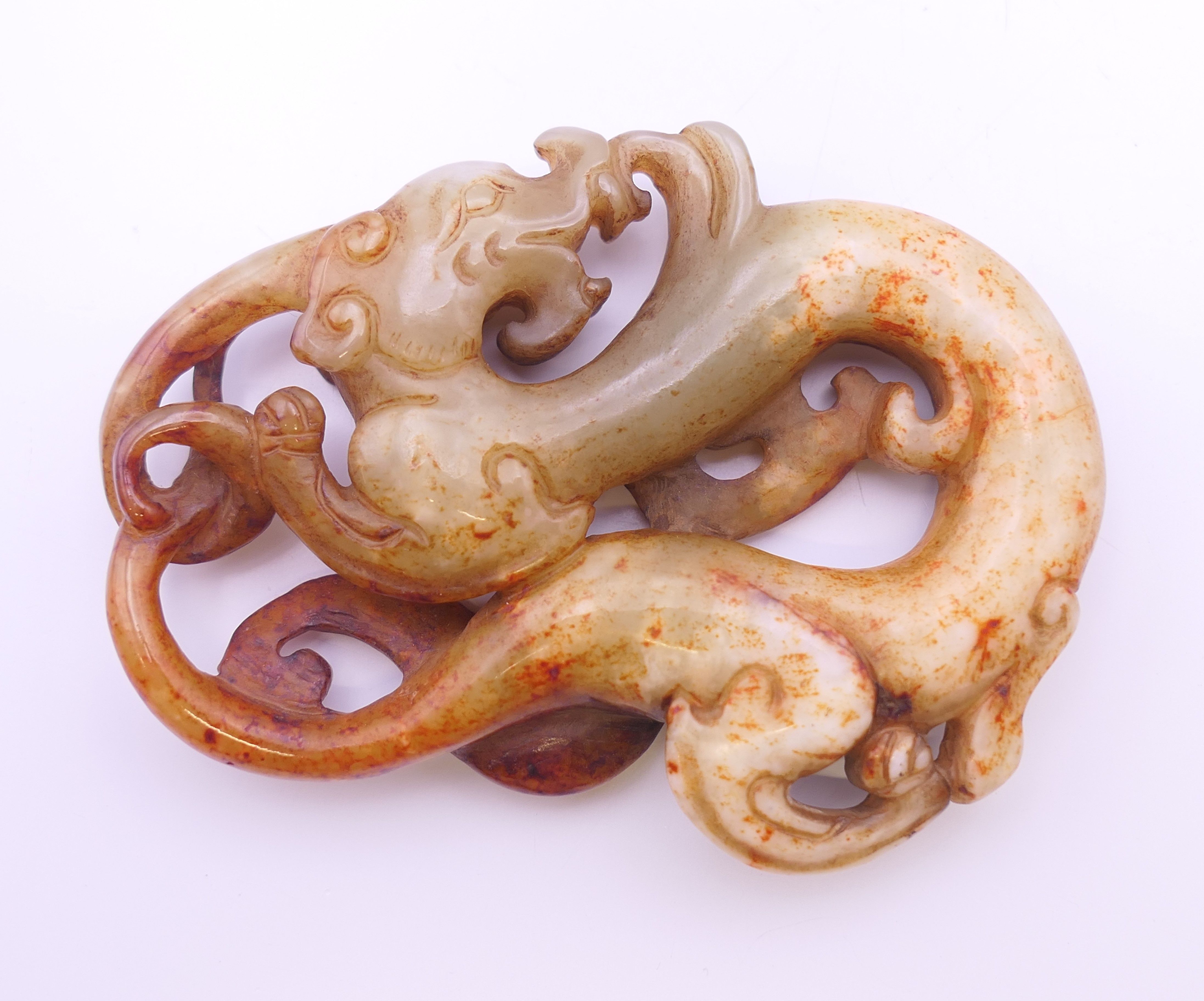 A Chinese white, yellow, green and red jade dragon pendant, Han Dynasty. 7 cm high. - Image 2 of 4