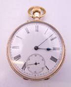 A 14 K gold open faced pocket watch. 4.5 cm diameter. 79.3 grammes total weight.