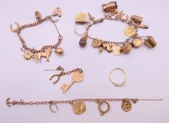 A 9 ct gold charm bracelet and charms. 61.3 grammes total weight.