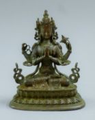 A small bronze model of a deity. 10 cm high.
