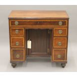 A 19th century mahogany kneehole desk. 83.5 cm wide.