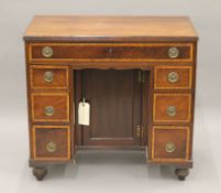 A 19th century mahogany kneehole desk. 83.5 cm wide.