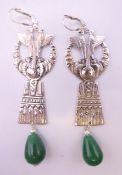 A pair of silver and jade Egyptian Revival earrings. 7 cm high.