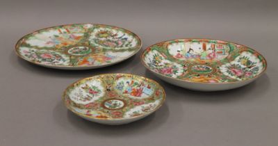 Three 19th century Canton famille rose dishes. The largest 24.5 cm diameter.