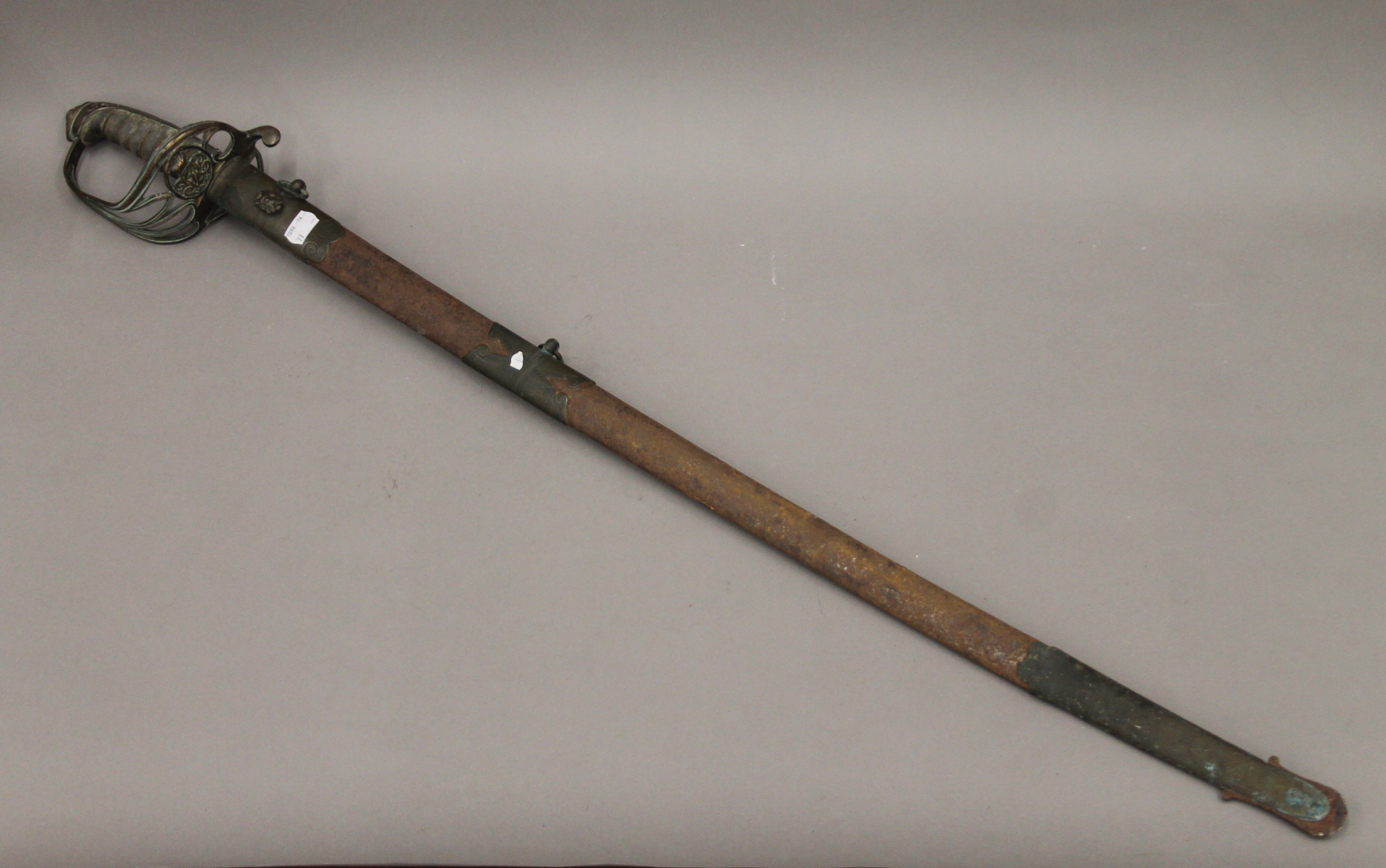 A Victorian Henry Wilkinson Service sword in scabbard. 102 cm long.