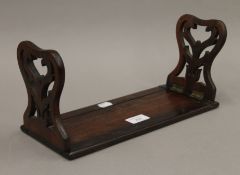 A Victorian rosewood book slide. 33 cm long when closed.