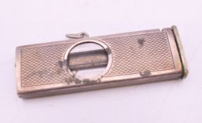 A silver cigar cutter. 5 cm long.