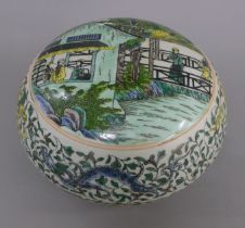 A Chinese famille verte round box. 24 cm diameter.