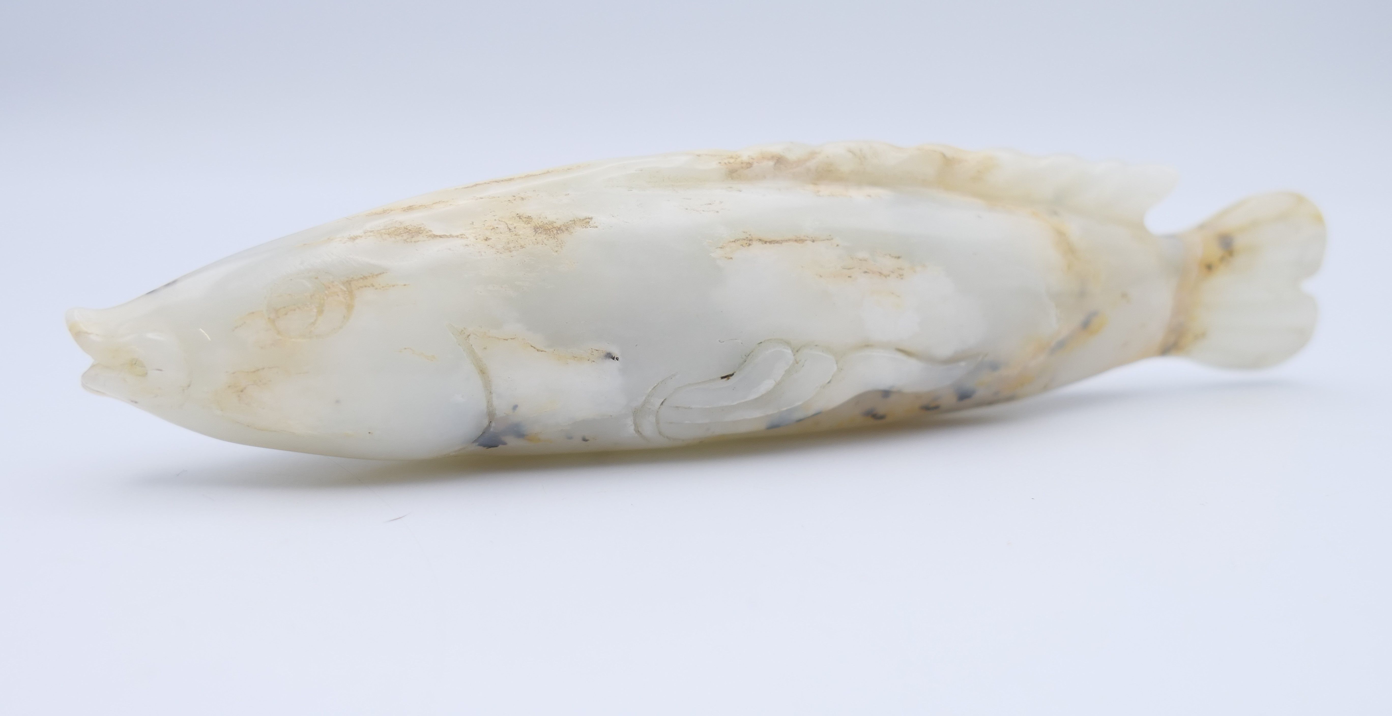 A small Chinese white jade fish, Yuan Dynasty. 12.5 cm long. - Image 2 of 8
