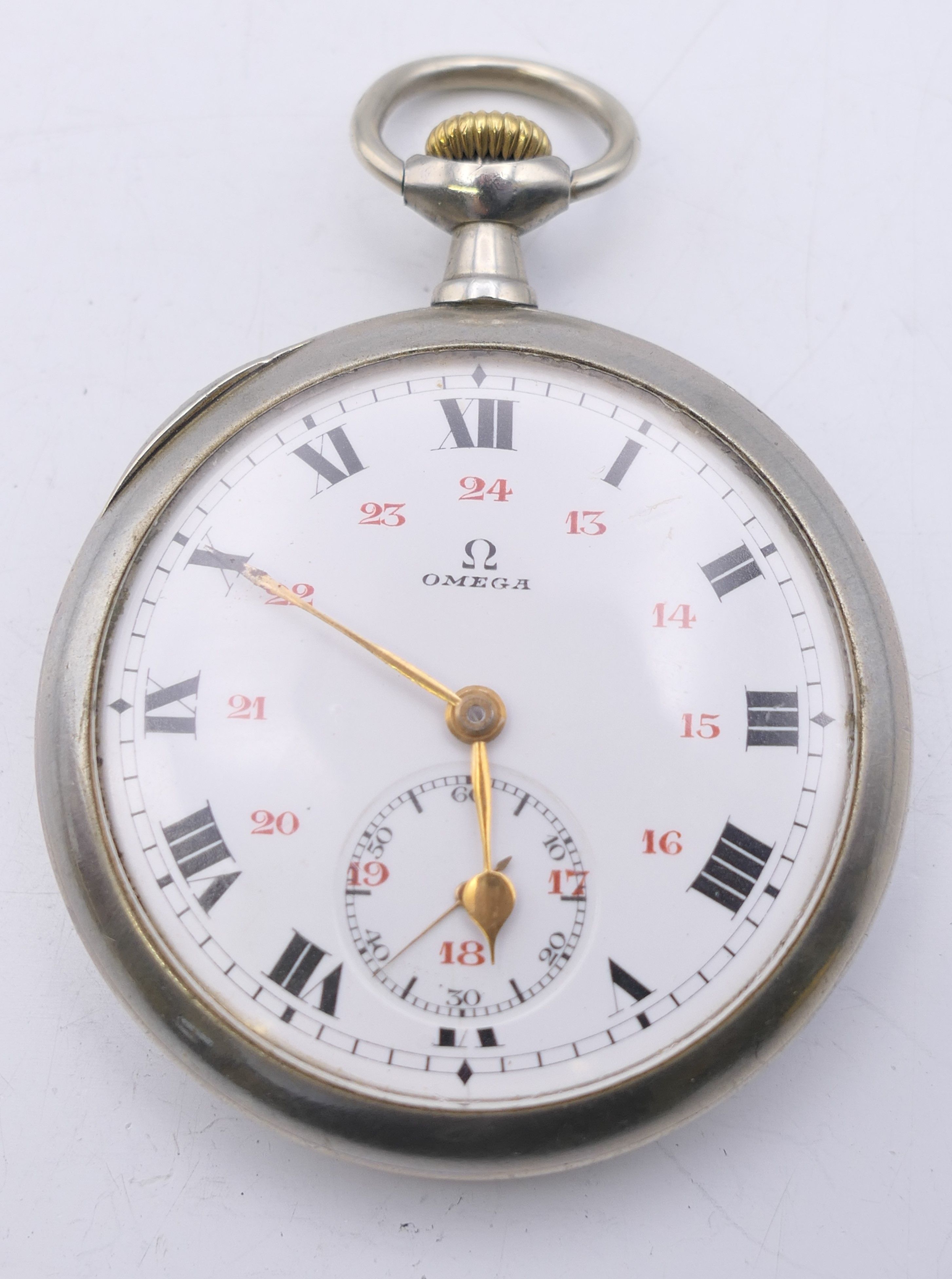 An Omega pocket watch, serial number 5455015. 4.5 cm diameter.