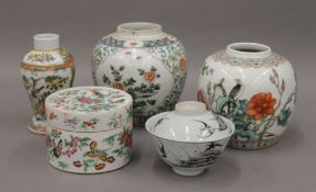 Two famille verte ginger jars, one famille rose lidded pot, a vase and a tea cup with seal marks.