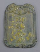 A bronze pendant. 8.5 cm high.