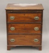 A 19th century mahogany chest of drawers with brushing slides. 69 cm wide.