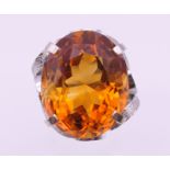 A platinum Madeira citrine ring. Citrine 2.5 cm x 1.5 cm. Ring size N/O. 20.8 grammes total weight.