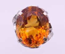 A platinum Madeira citrine ring. Citrine 2.5 cm x 1.5 cm. Ring size N/O. 20.8 grammes total weight.