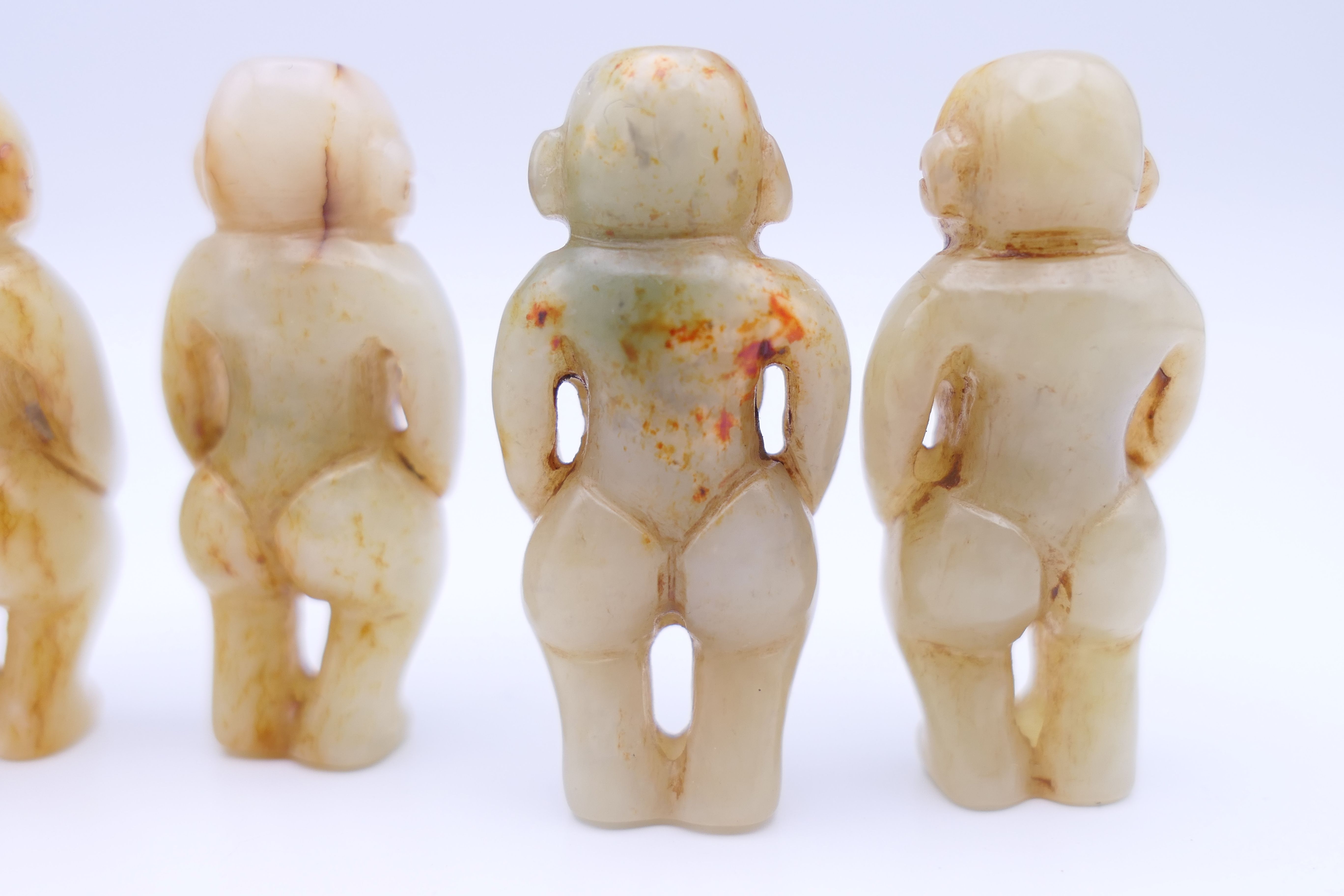 Nine Chinese fertility beads (seven male and two female), Han Dynasty. Each approximately 4 cm high. - Image 7 of 17