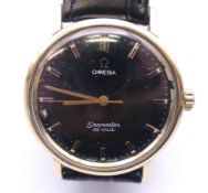 A gentleman's Omega Seamaster De Ville wristwatch with black dial. 3.5 cm wide.