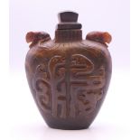 A Chinese carved horn snuff bottle. 6.5 cm high. Provenance: The Larkin/Minney Collection.