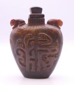 A Chinese carved horn snuff bottle. 6.5 cm high. Provenance: The Larkin/Minney Collection.