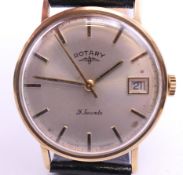 A 9 ct gold Rotary gentleman's wristwatch. 3.5 cm wide. 28.4 grammes total weight.