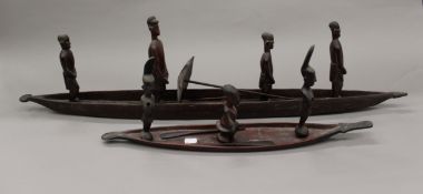 Two African hardwood model boats. The largest 95 cm long.