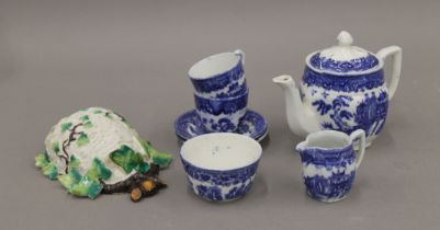 A child's Willow pattern blue and white tea set and posy holder. The teapot 11 cm high.