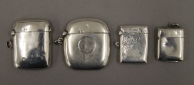 Four silver vesta cases. The largest 5 cm high. 73.7 grammes.