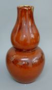 A Chinese red double gourd vase. 41 cm high.