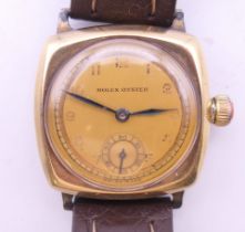 A gentleman's 9 ct gold Rolex Oyster wristwatch on a later strap. 2.5 cm wide. 27.