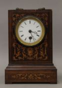 A 19th century inlaid rosewood mantle clock. 23 cm high.