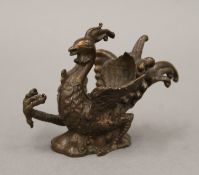 A bronze model of a bird. 6 cm high.