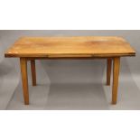 A teak drawer leaf dining table. 252 cm long extended x 79.5 cm wide.