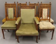 A set of six Victorian carved oak dining chairs, together with a carved oak arm chair en-suite.