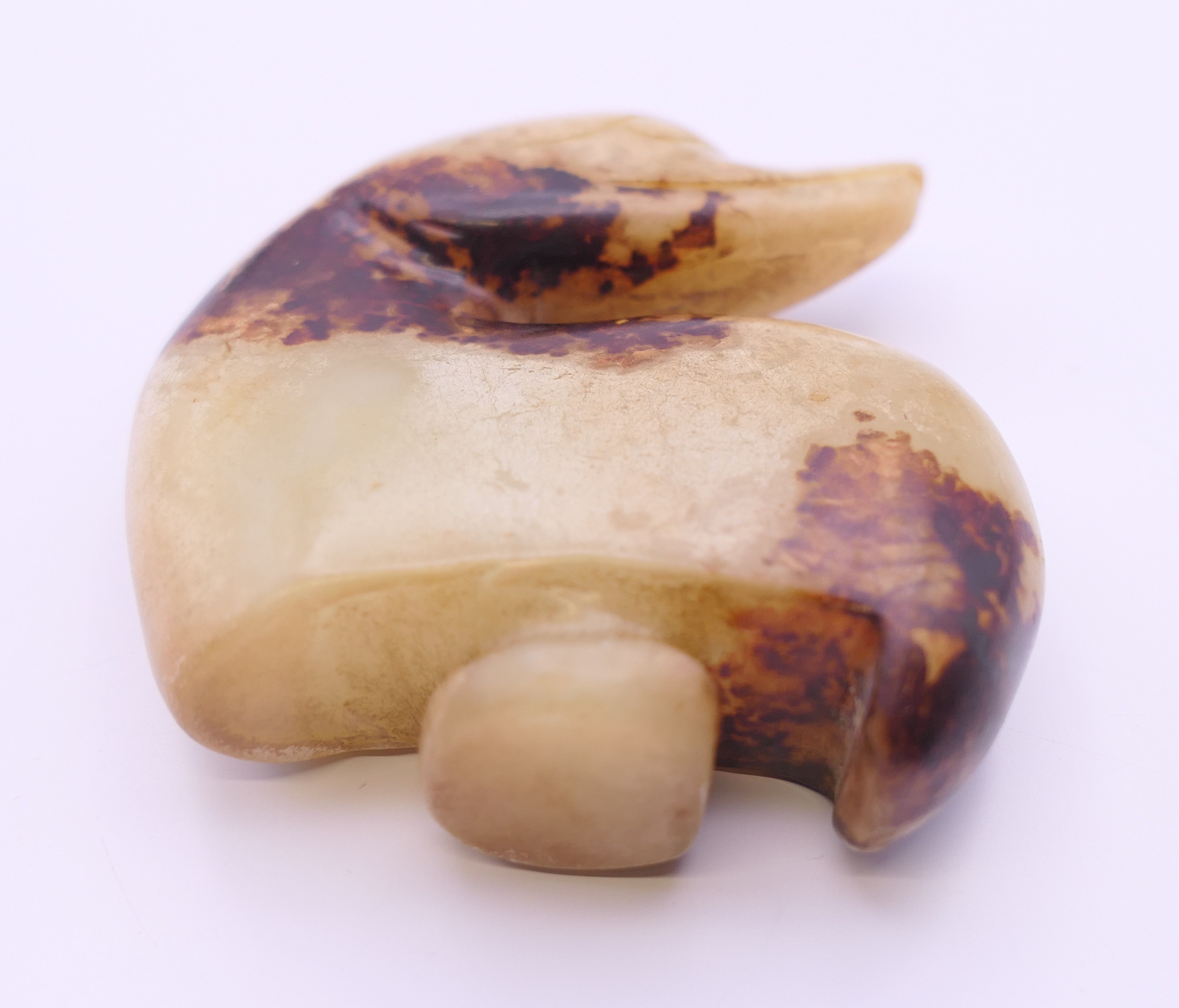 A Chinese off white and brown jade duck belt hook, Ming Dynasty. 5.5 cm high. - Image 3 of 7