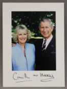 A photograph of King Charles III and Queen Consort Camilla mounted on a signed card. 21 x 28.5 cm.