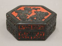 A cinnabar lacquer box. 17 cm wide.