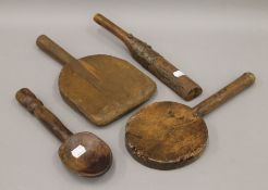 A quantity of treen, including pats, a spoon, etc. The largest 31.5 cm long.