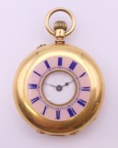 An 18 K gold enamelled half hunter timepiece, stamped to interior, in working order. 3.