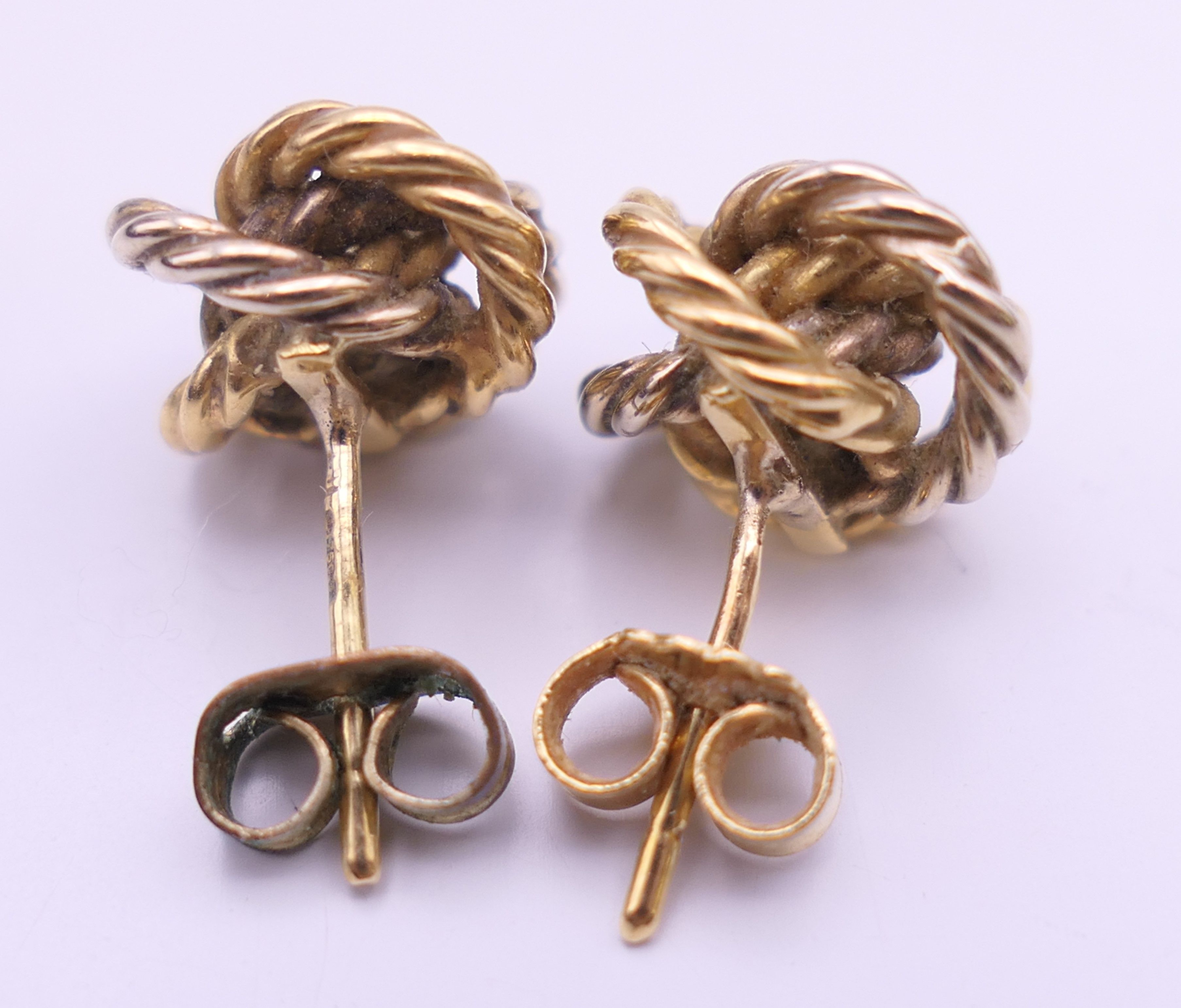 A pair of 18 ct gold knot form earrings, - Image 3 of 9