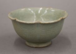 A Chinese light green fluted bowl, Ming Dynasty. 9 cm diameter.
