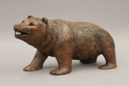 A 19th century carved wooden Blackforest bear. 36 cm long.