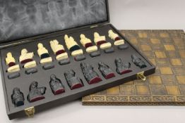 A boxed chess set and board. The board 45.5 cm squared.