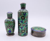 Two enamel decorated scent bottles and a pill box. The largest 7.5 cm high.