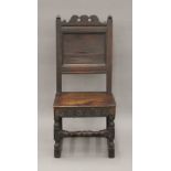 An 18th century oak panelled side chair. 45.5 cm wide.