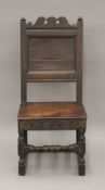An 18th century oak panelled side chair. 45.5 cm wide.