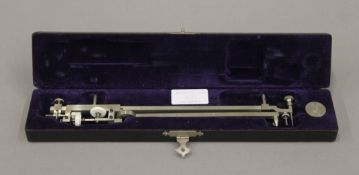 A cased vintage Planimeter. The case 31 cm long.