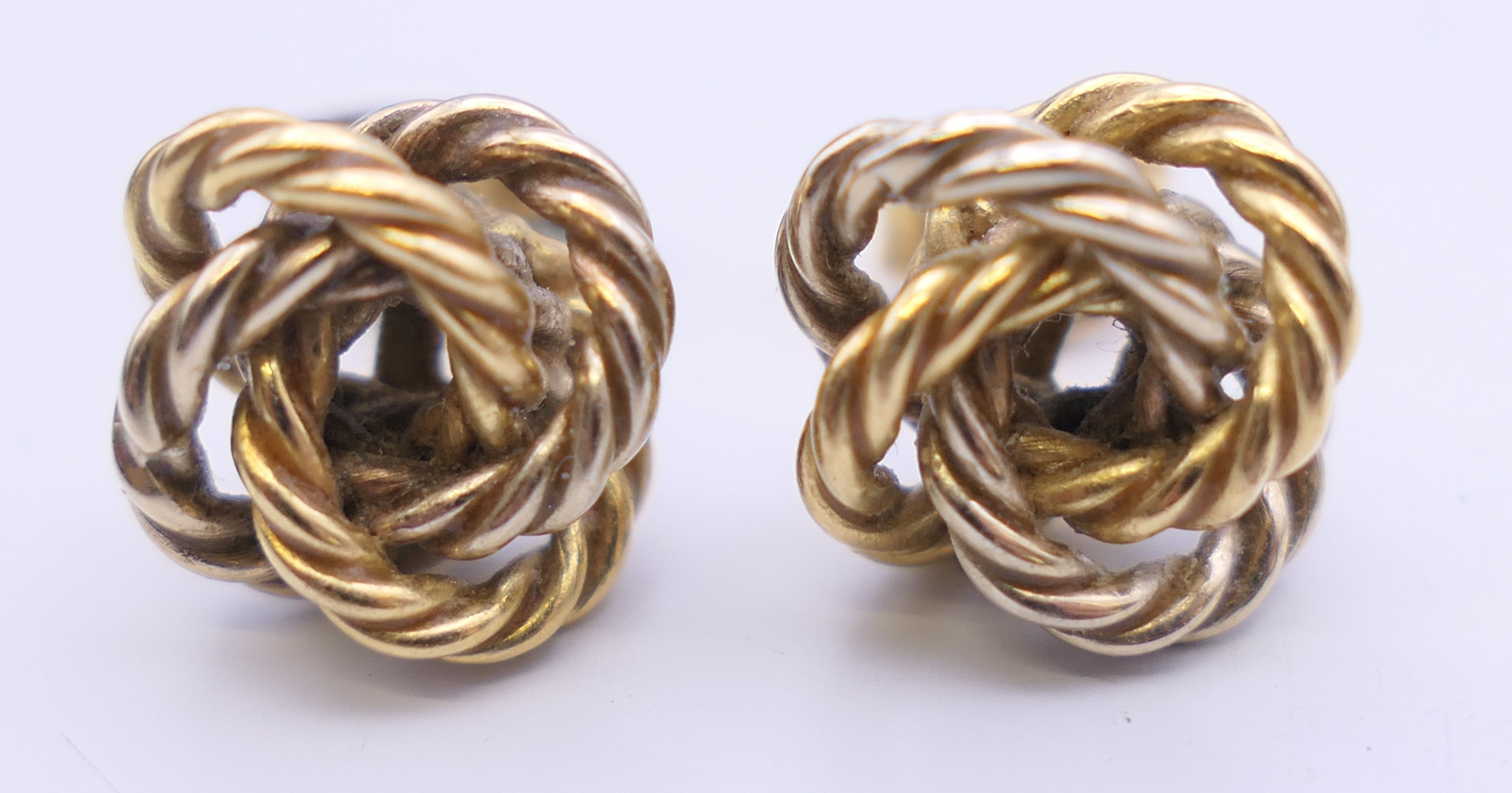A pair of 18 ct gold knot form earrings, - Image 2 of 9